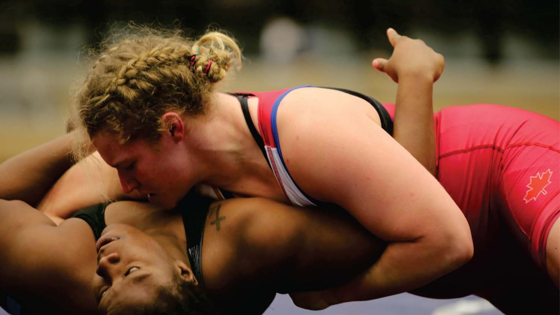 Payton Smith pins her opponent on a wrestling map.
